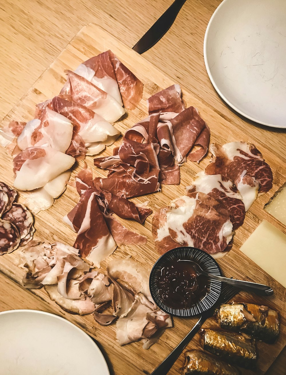 sliced meat on brown wooden chopping board