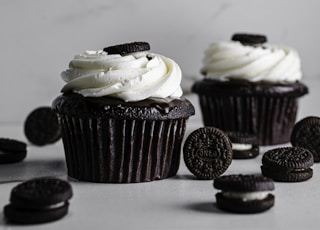 white and brown cupcakes on white table