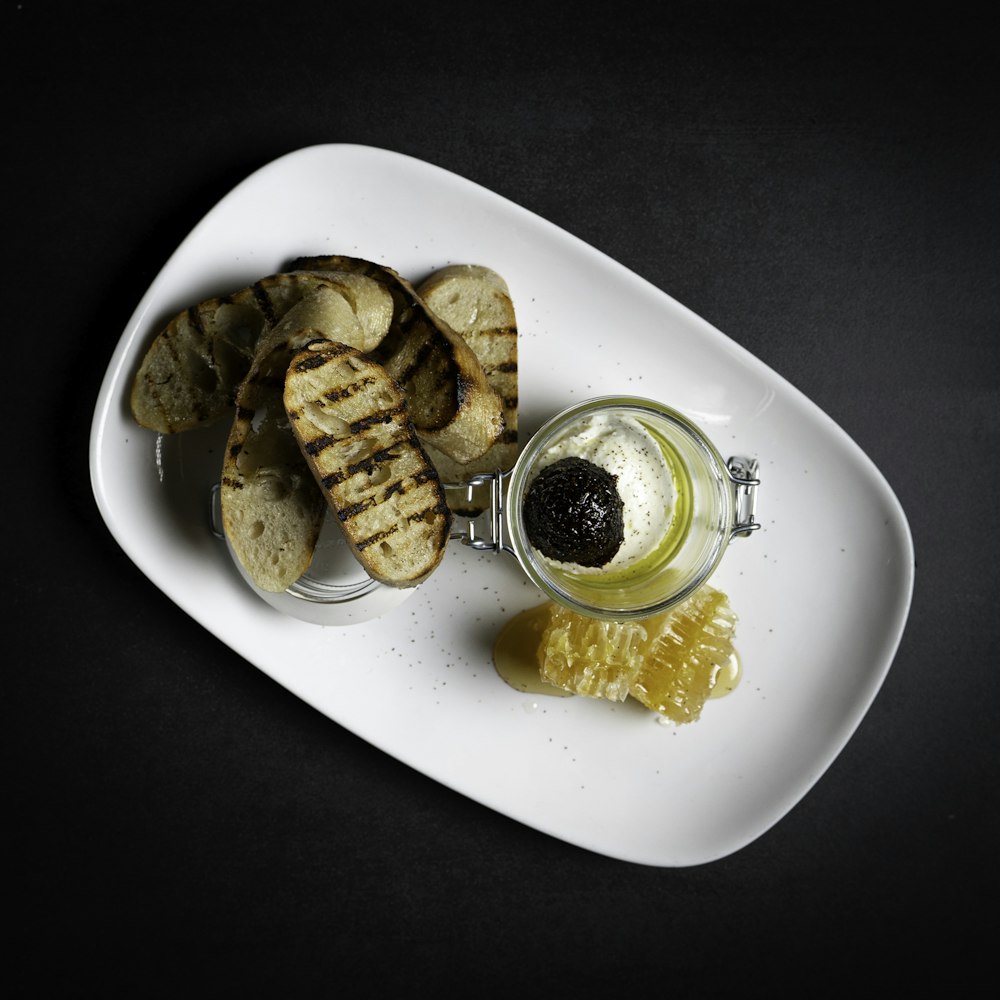 sliced banana and lemon on white ceramic plate