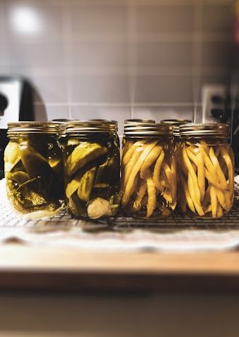 clear glass jar with yellow banana fruits