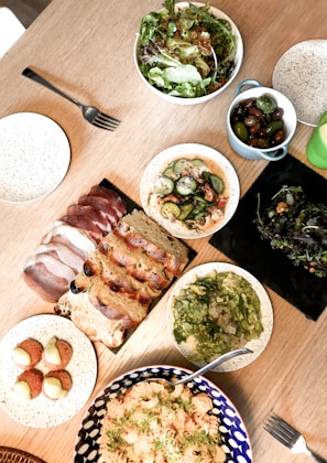 An assortment of traditional Argentine dishes on a wooden table.