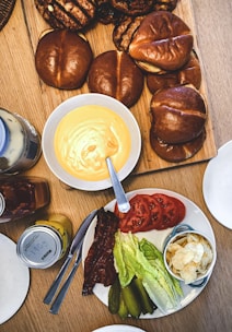 Modern kitchen setup with cooking utensils and ingredients ready for a burger-making class.