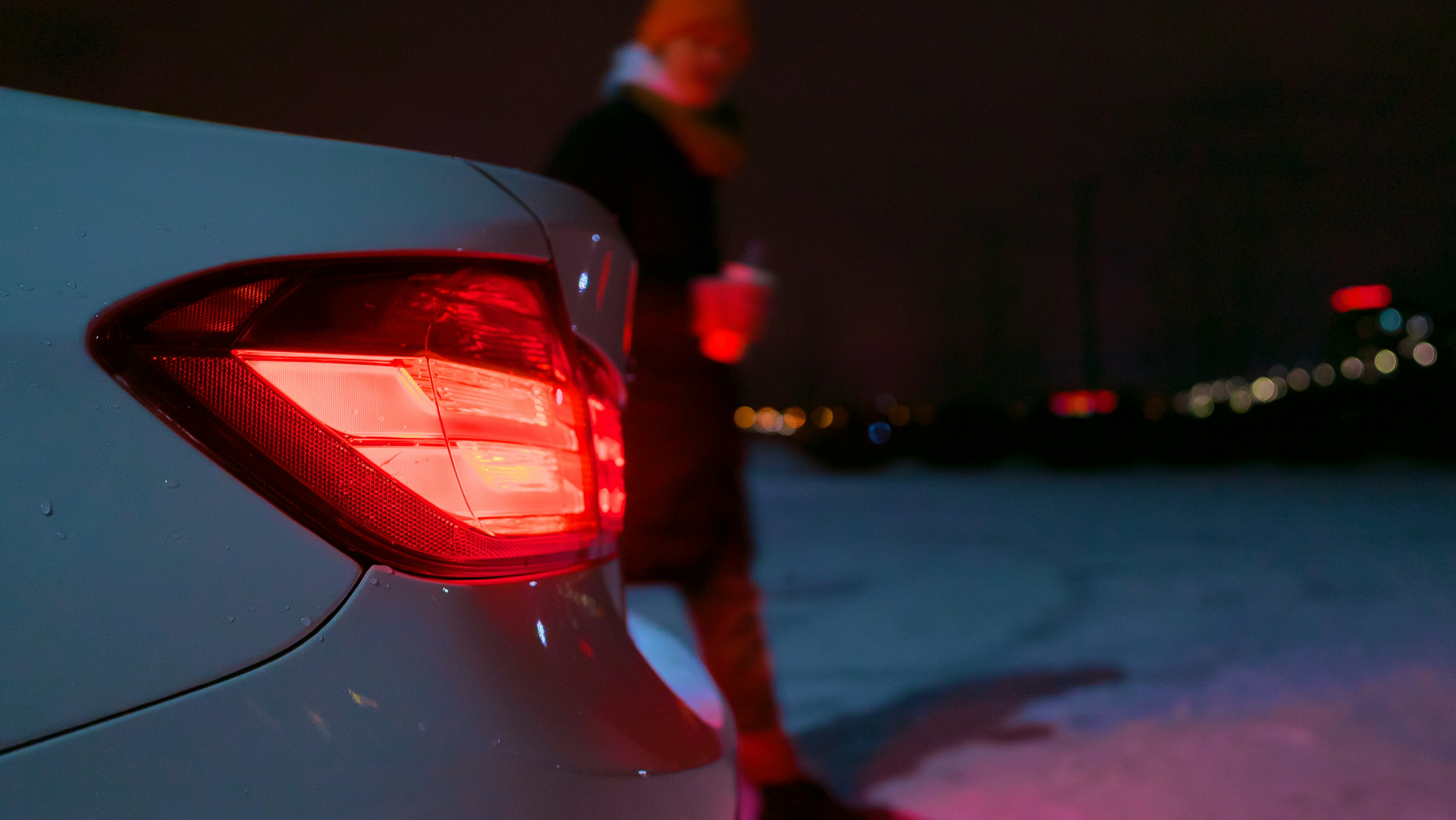 red car on road during night time