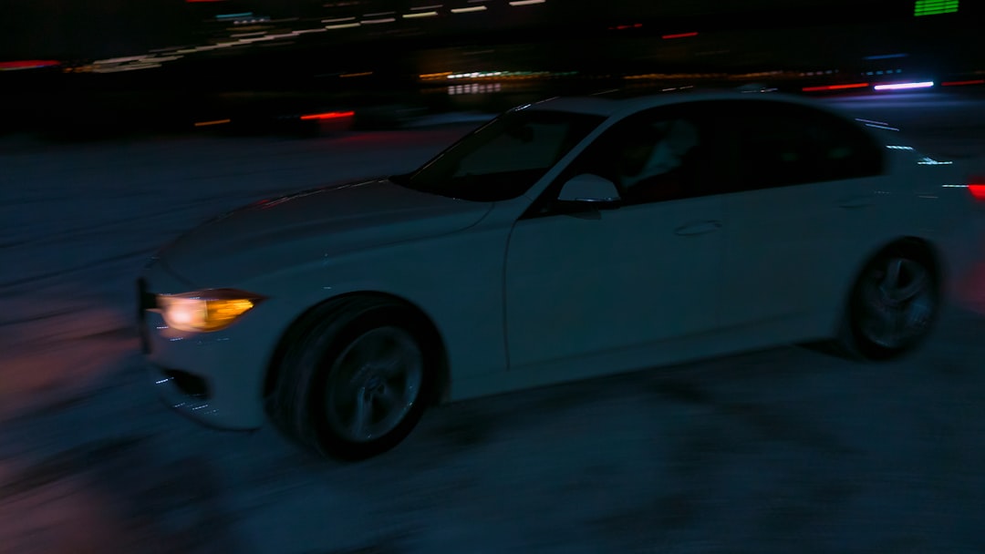 white sedan on road during night time