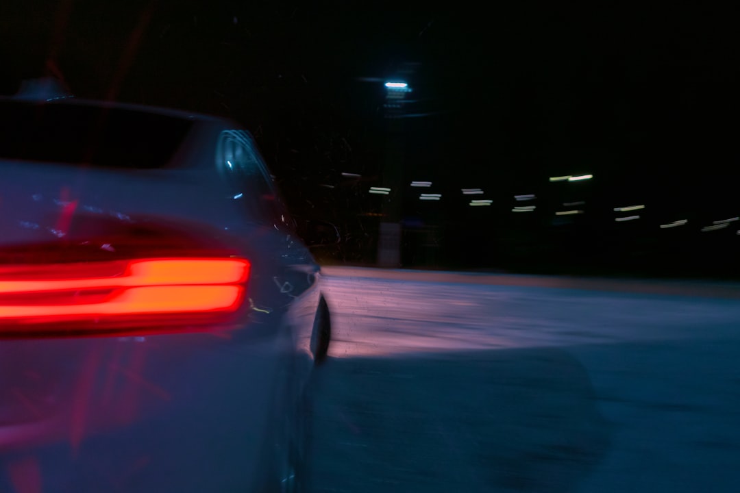 black car on road during night time