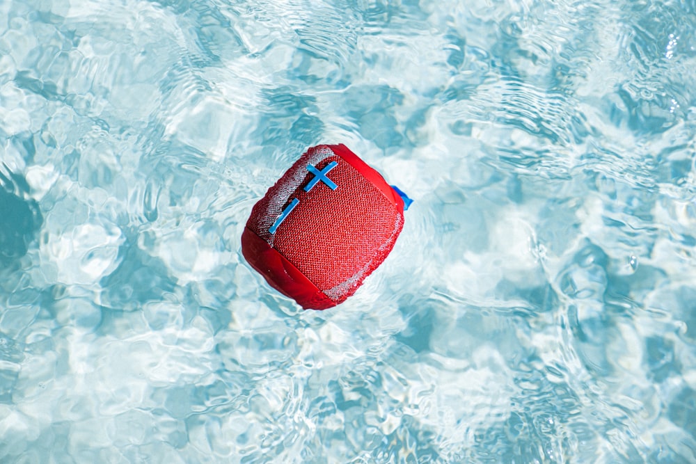 red and blue swimming cap on water