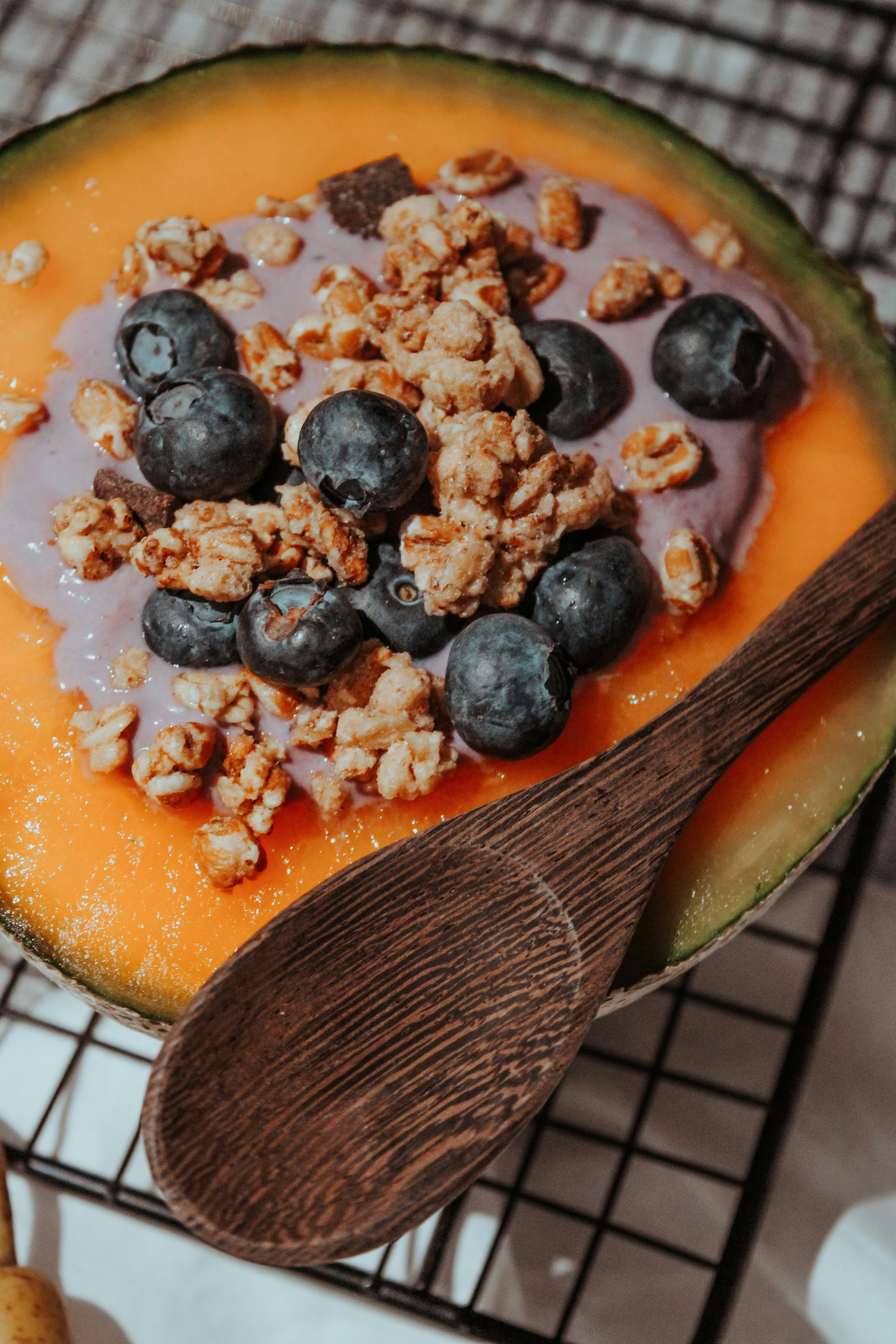 black berries on orange ceramic plate