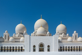 white and brown dome building under blue sky during daytime