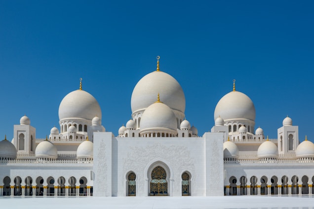 white and brown dome building under blue sky during daytime