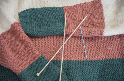 red and green knit textile