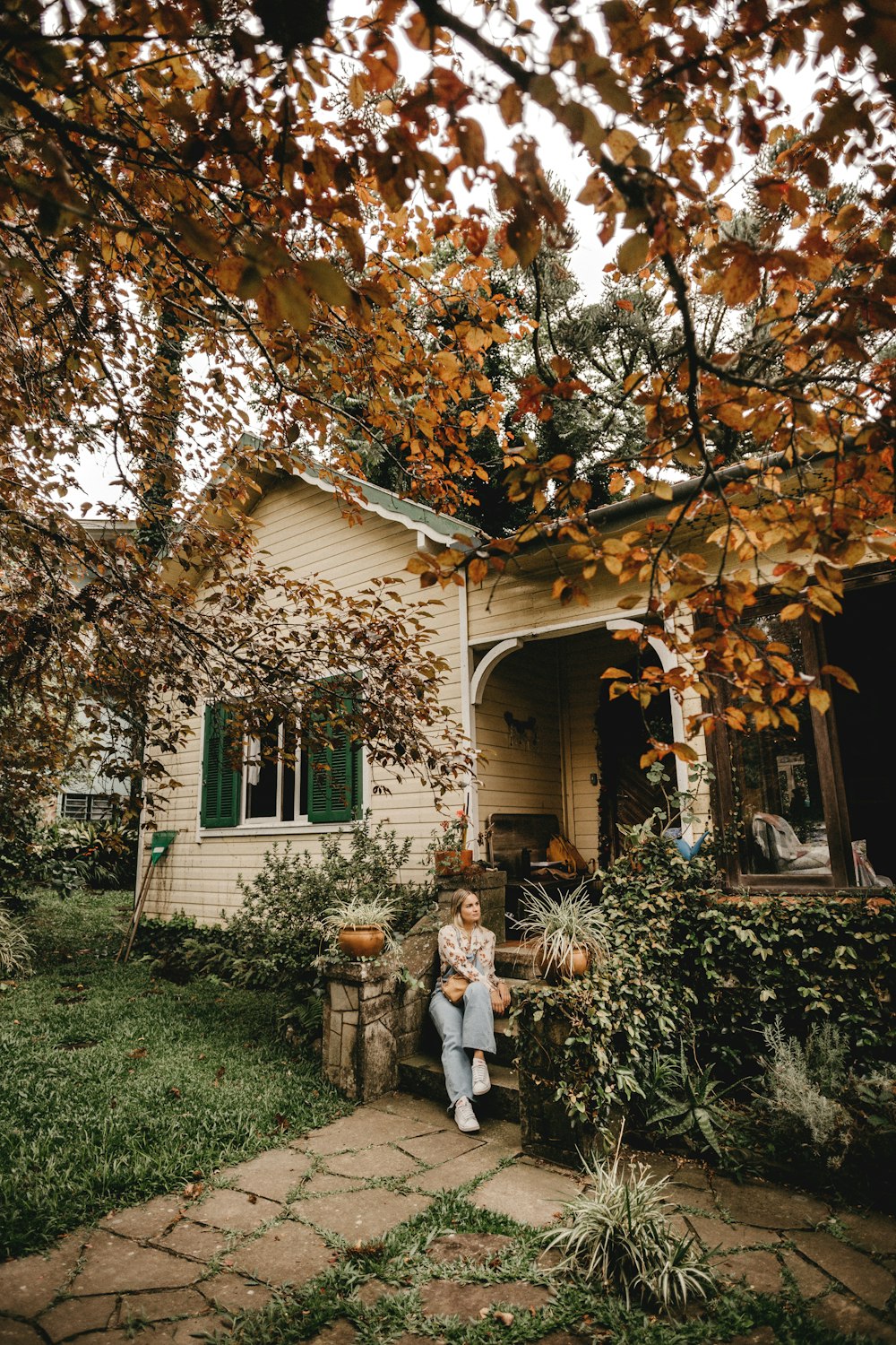 man and woman standing beside tree during daytime