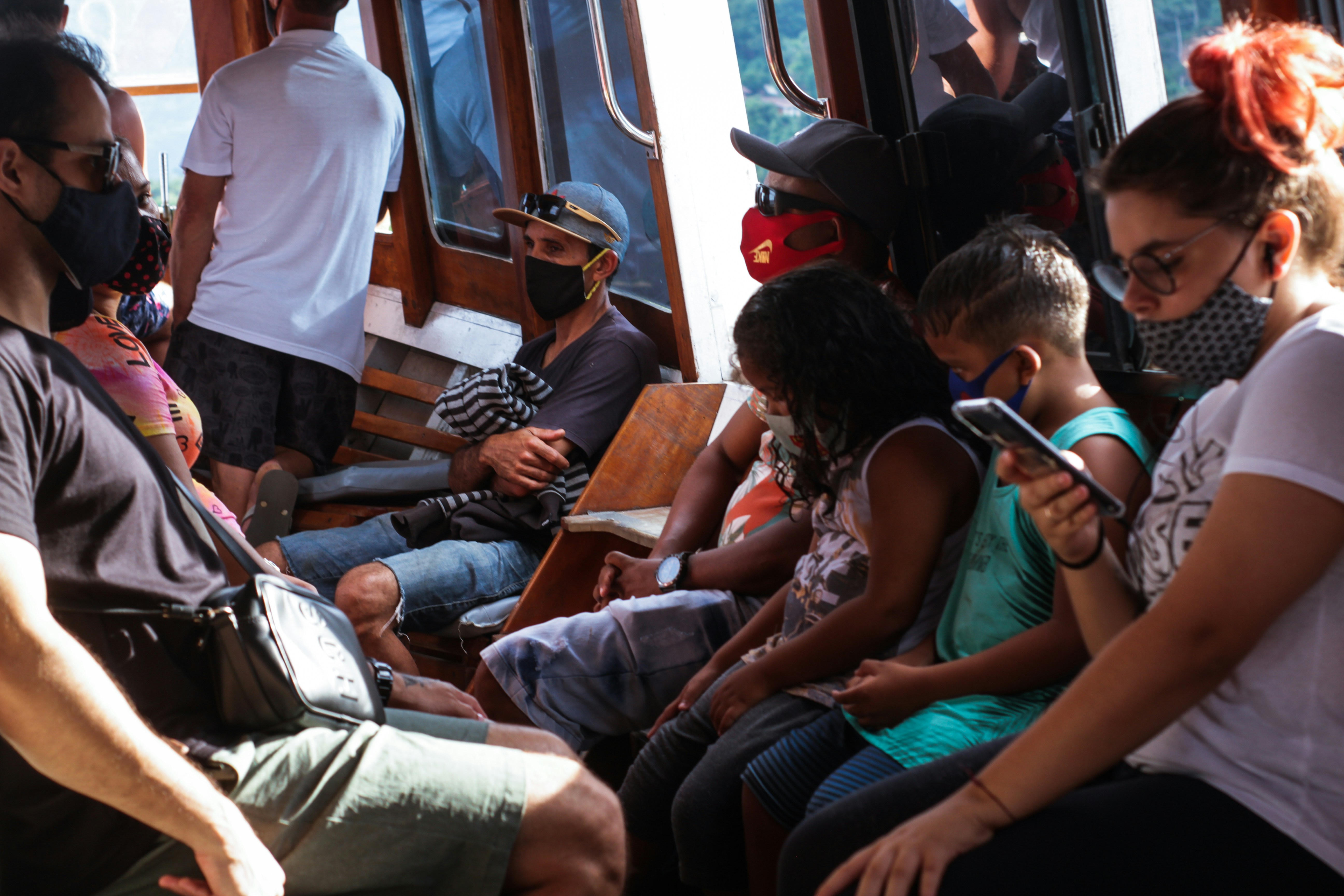 people sitting on vehicle seat