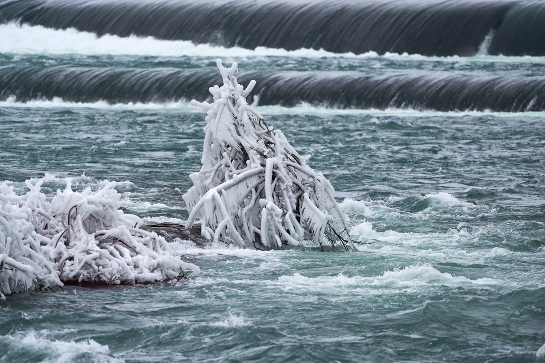 water falls with white and black rocks