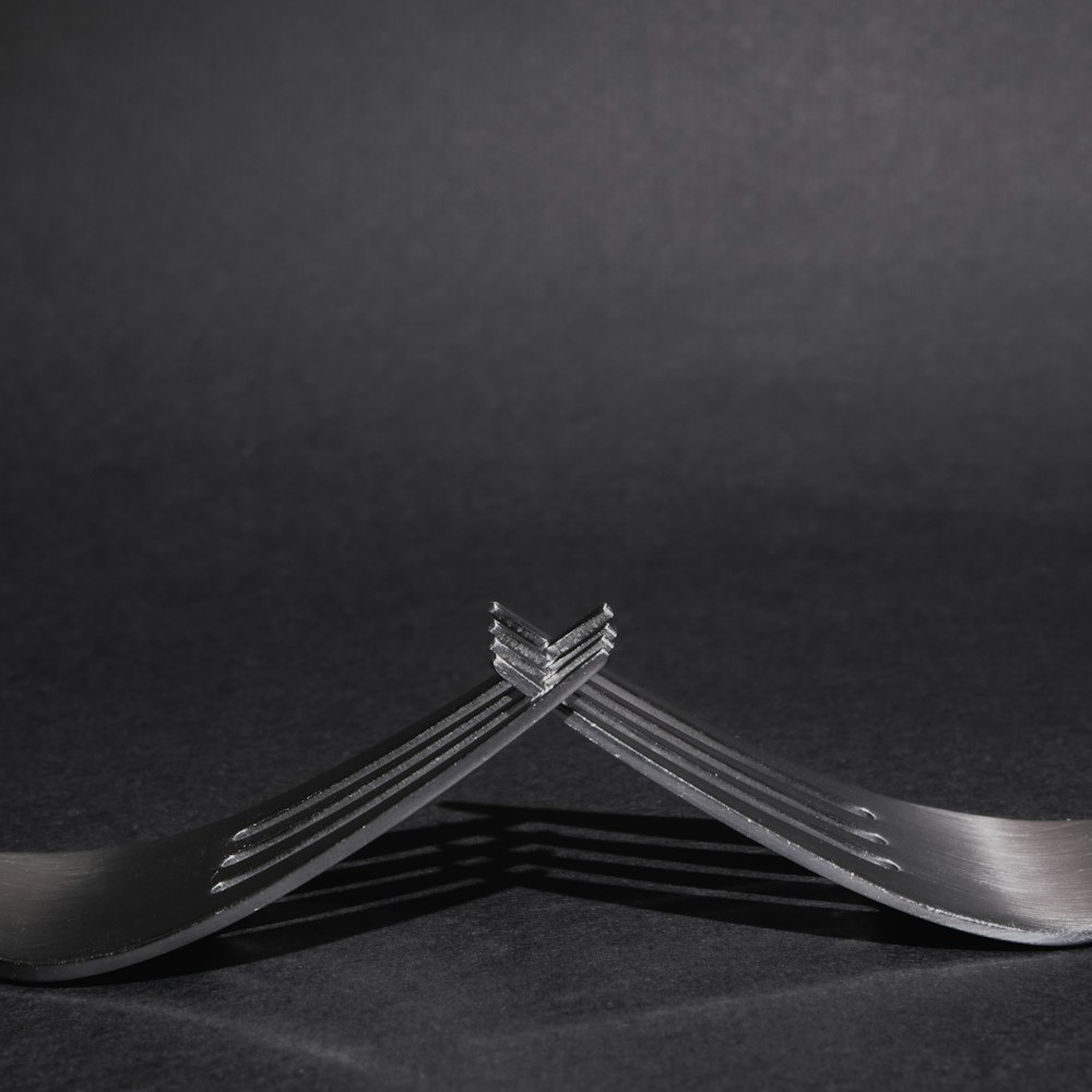 silver fork with black background
