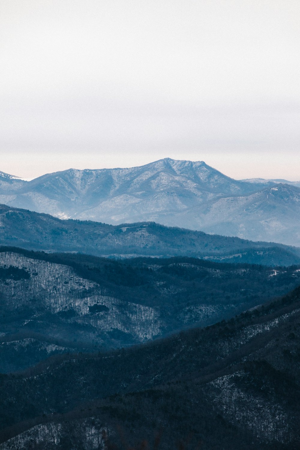 green and black mountains under white sky during daytime