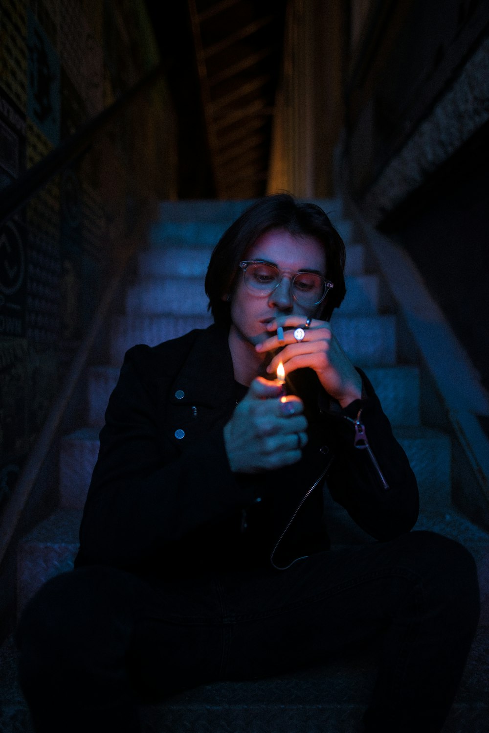 woman in black coat smoking cigarette