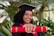 A student holding their admission letter with joy.