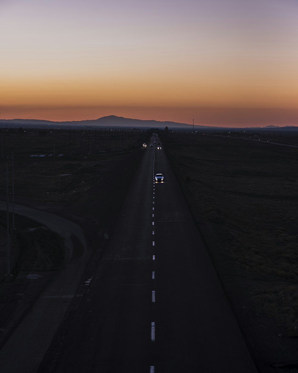 black asphalt road during sunset