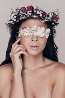 woman with white flower on her ear