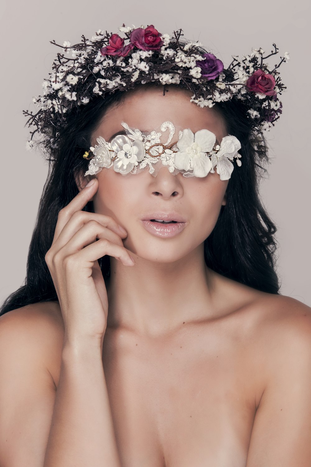 woman with white flower on her ear