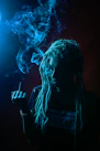 man in black crew neck t-shirt smoking cigarette