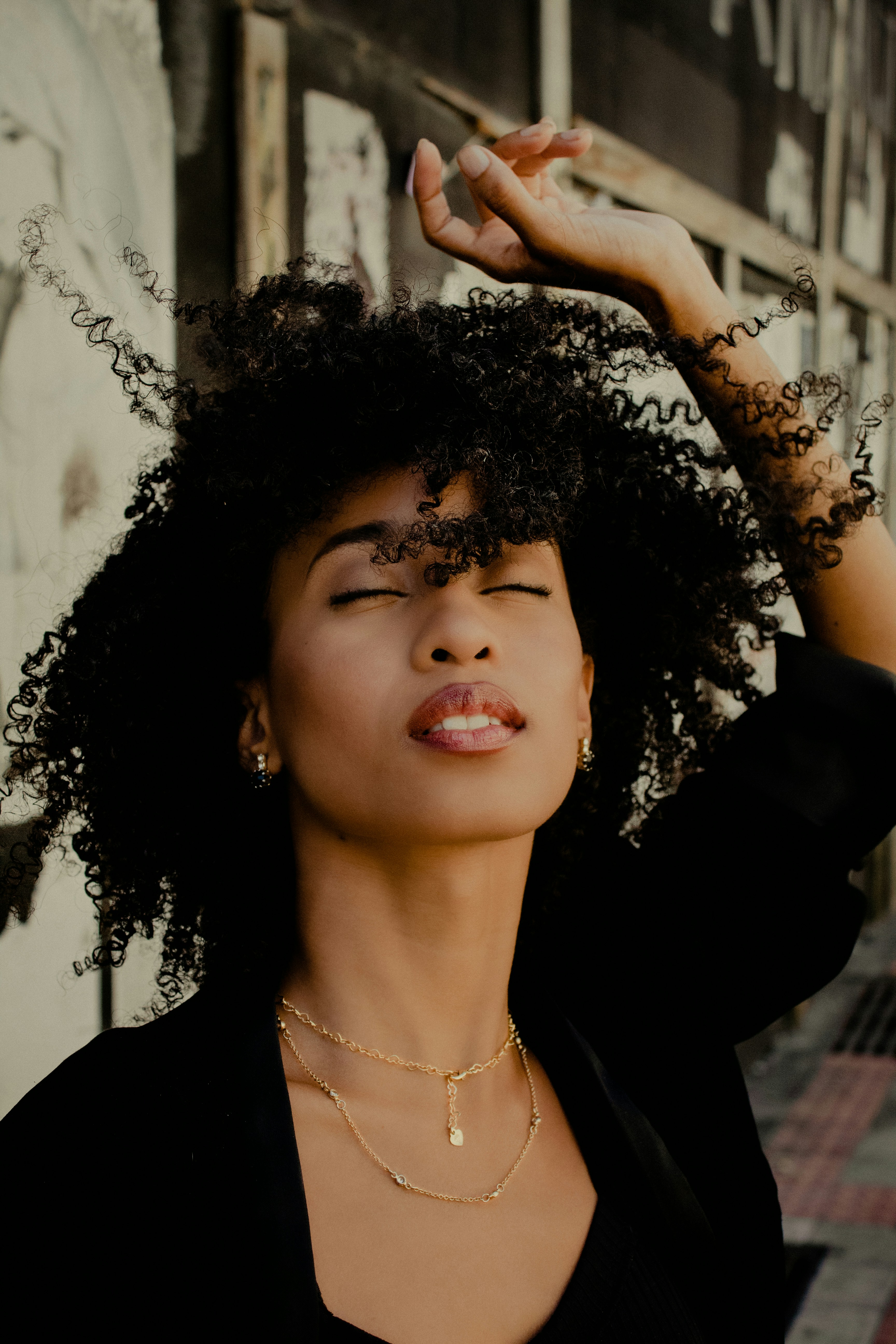 woman in black shirt with silver necklace