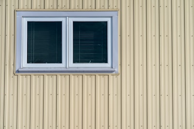 white wooden window frame with white window blinds