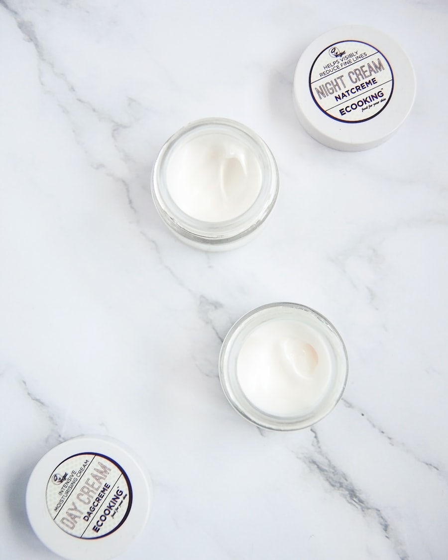Velvet Cream, open jars of whipped moisturizer resting on a white marble surface