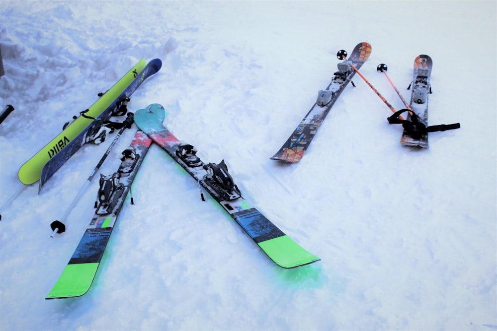 person in green and black snow ski