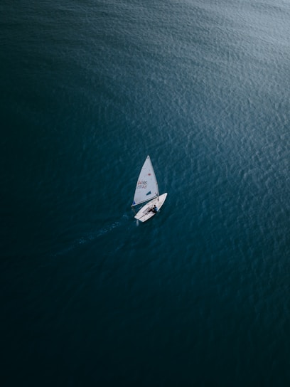 white boat on blue sea during daytime
