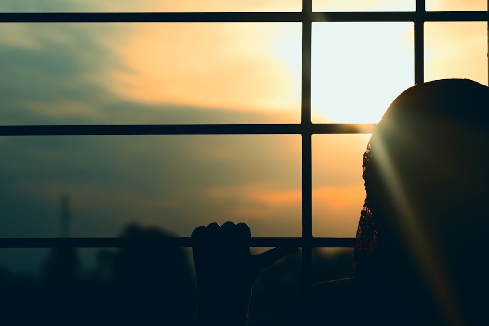 silhouette of people sitting on chairs during sunset