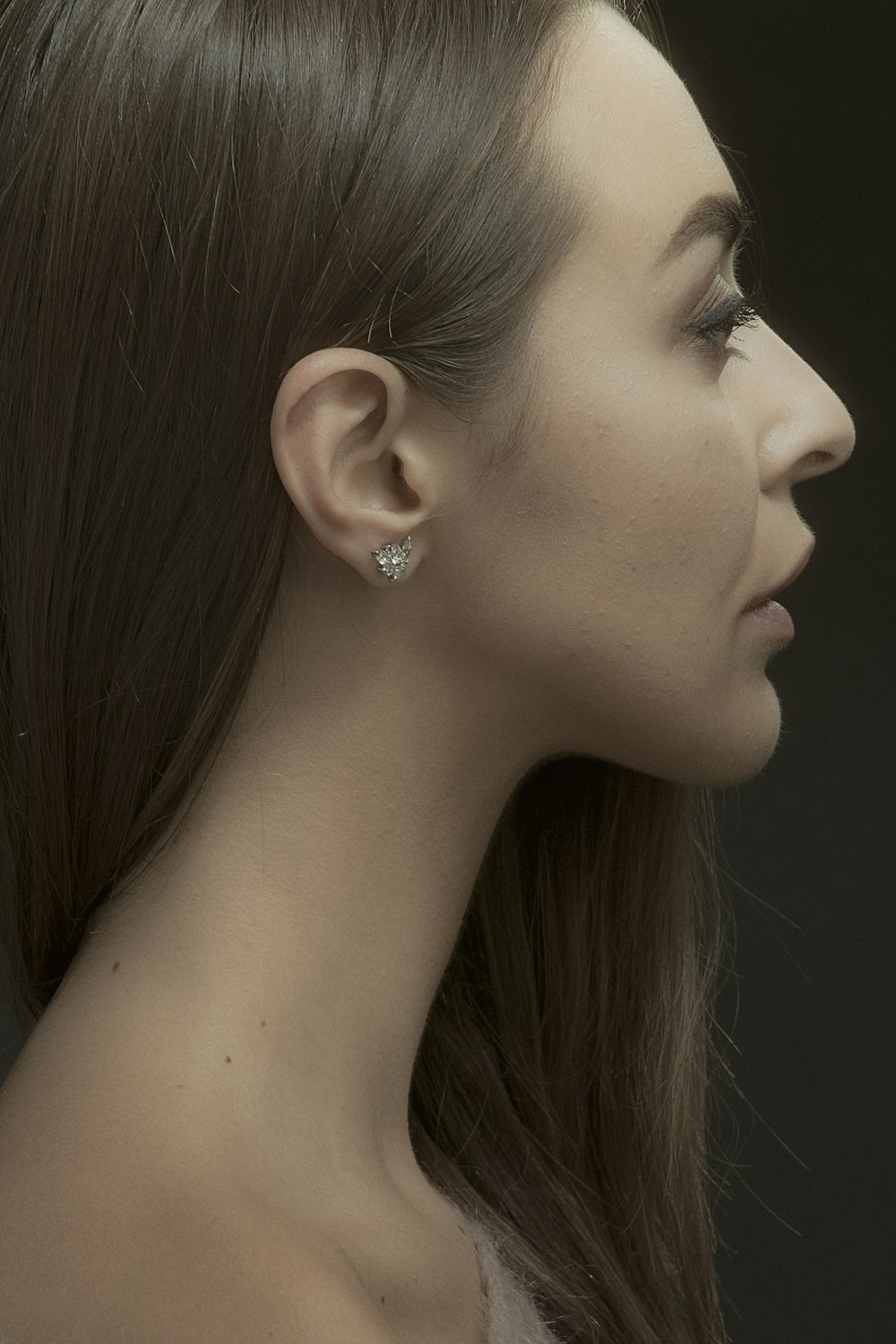 woman with silver stud earring