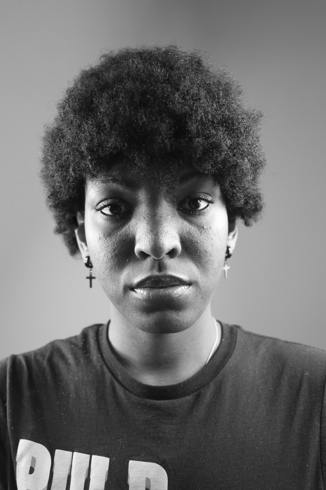 grayscale photo of man in crew neck shirt