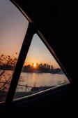 Sunset view through the window of a Nissan Urban vehicle on a coastal road