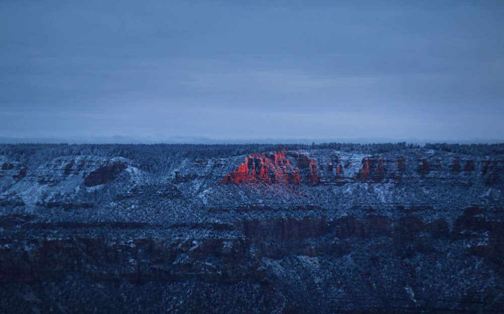 gray rocky mountain under gray sky