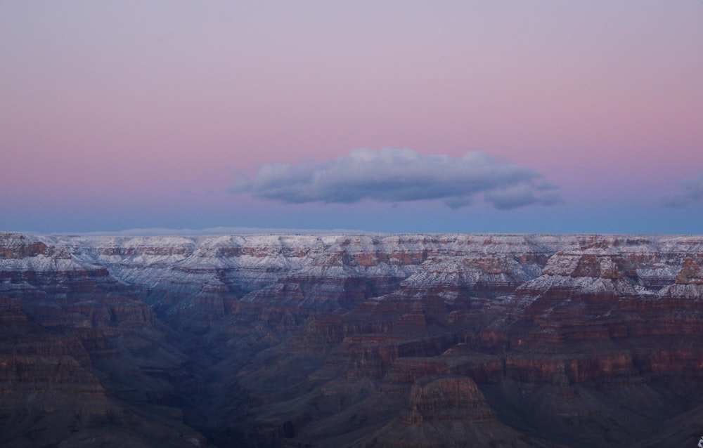 brown rocky mountain under white sky during daytime