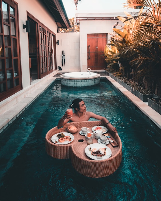 woman in swimming pool during daytime