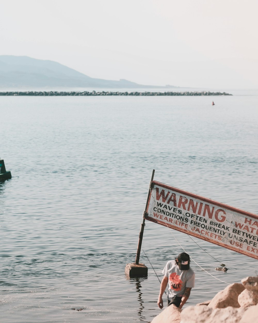 people sitting on green boat on sea during daytime