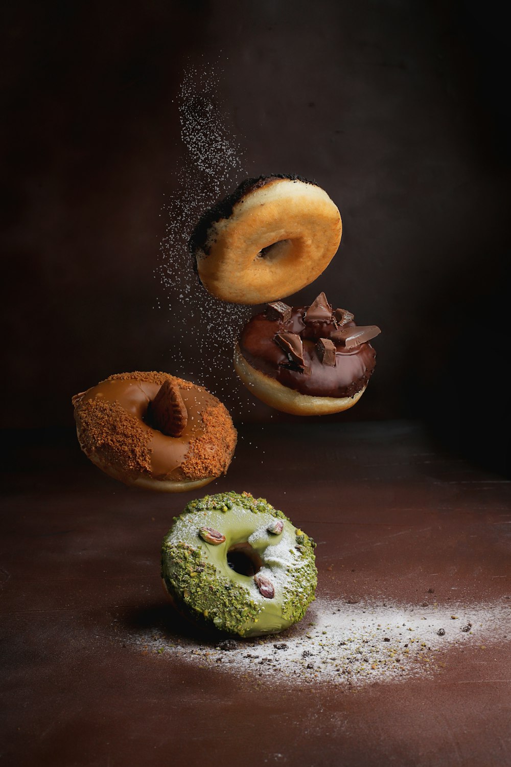 two doughnuts on brown wooden table