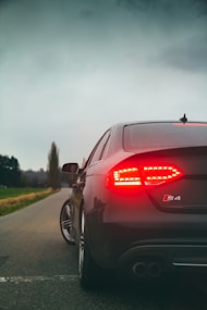 black car on road during daytime