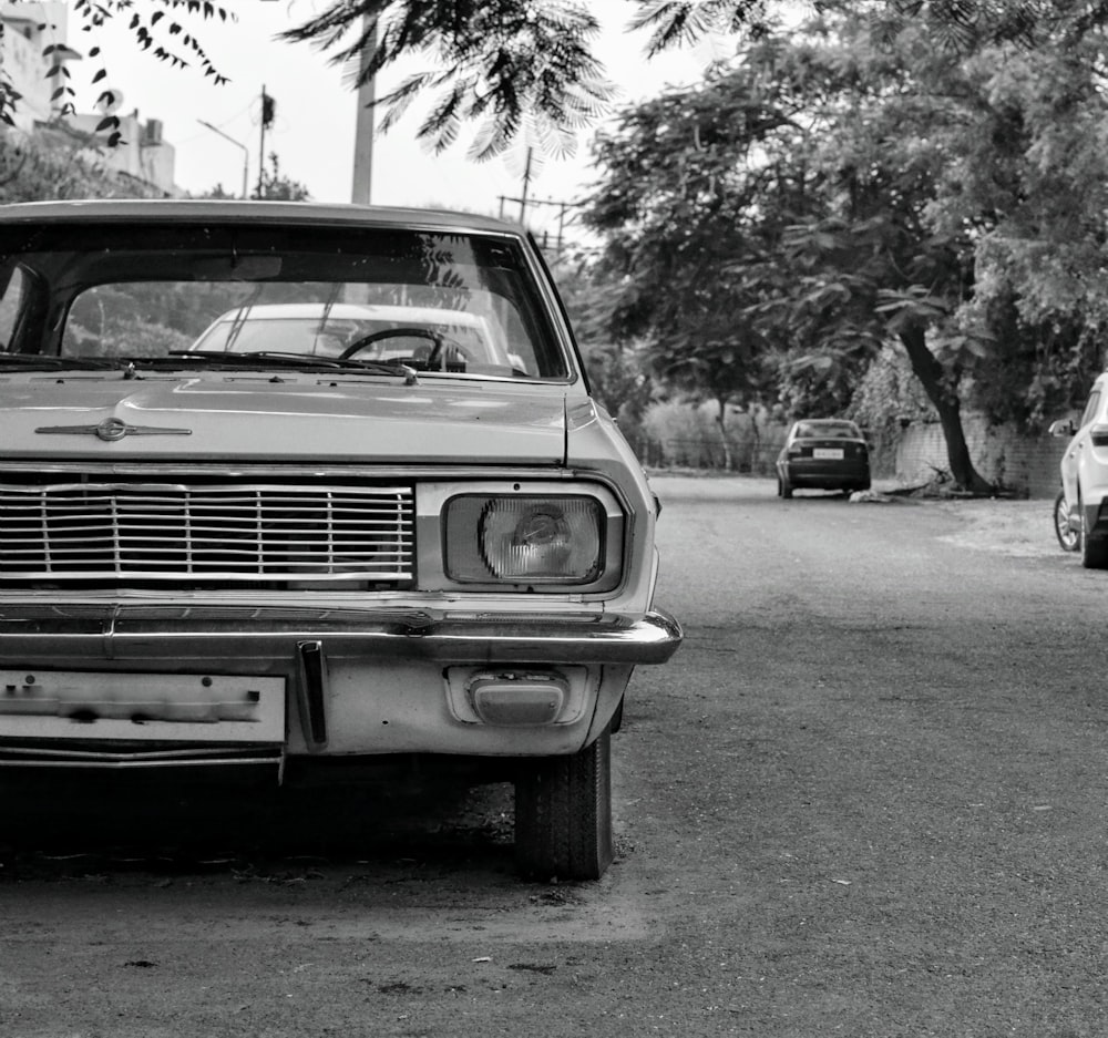 grayscale photo of vintage car