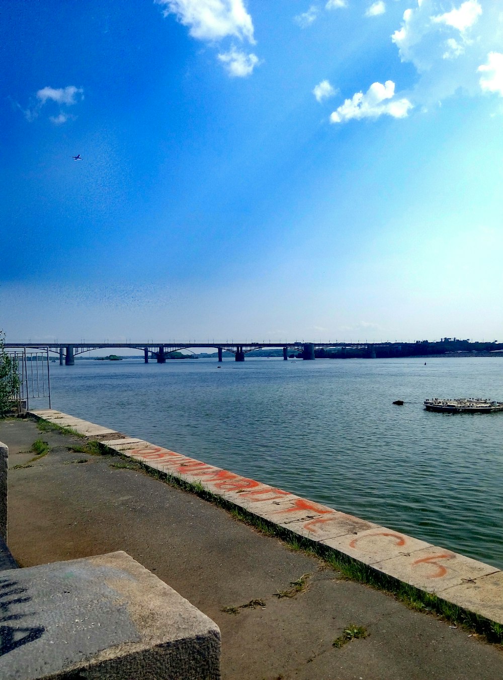 brown wooden dock on sea under blue sky during daytime