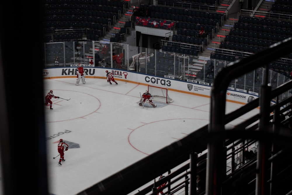 people playing ice hockey on ice stadium