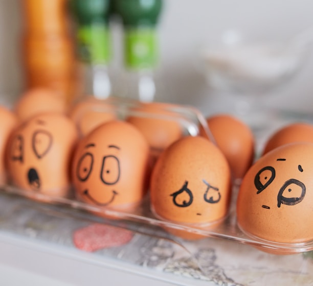 brown eggs on white tray