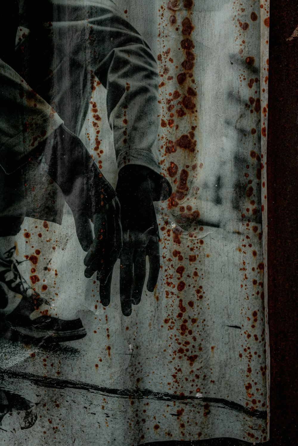 person in black leather boots standing on white and red concrete floor