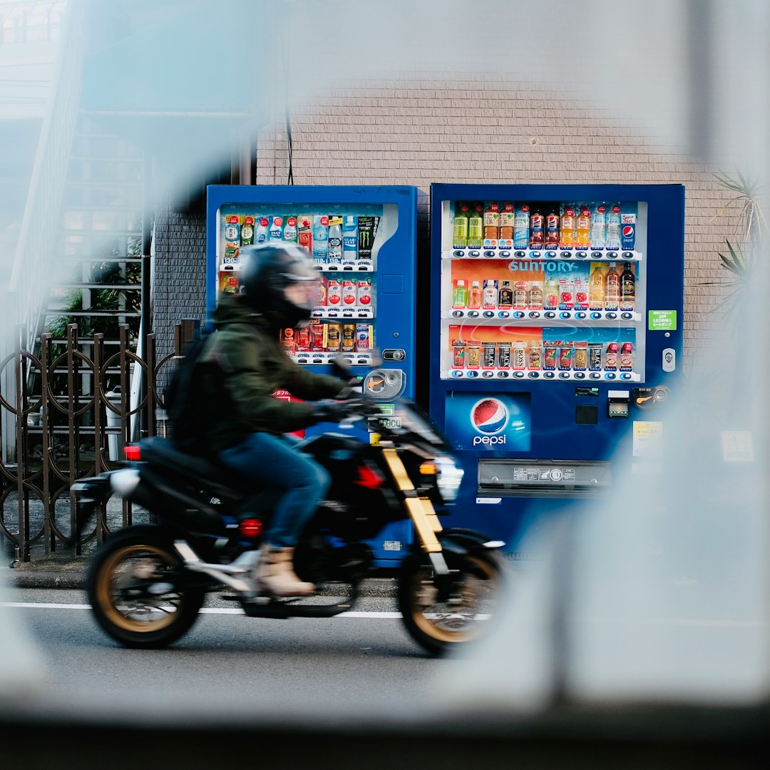 man in black jacket riding motorcycle