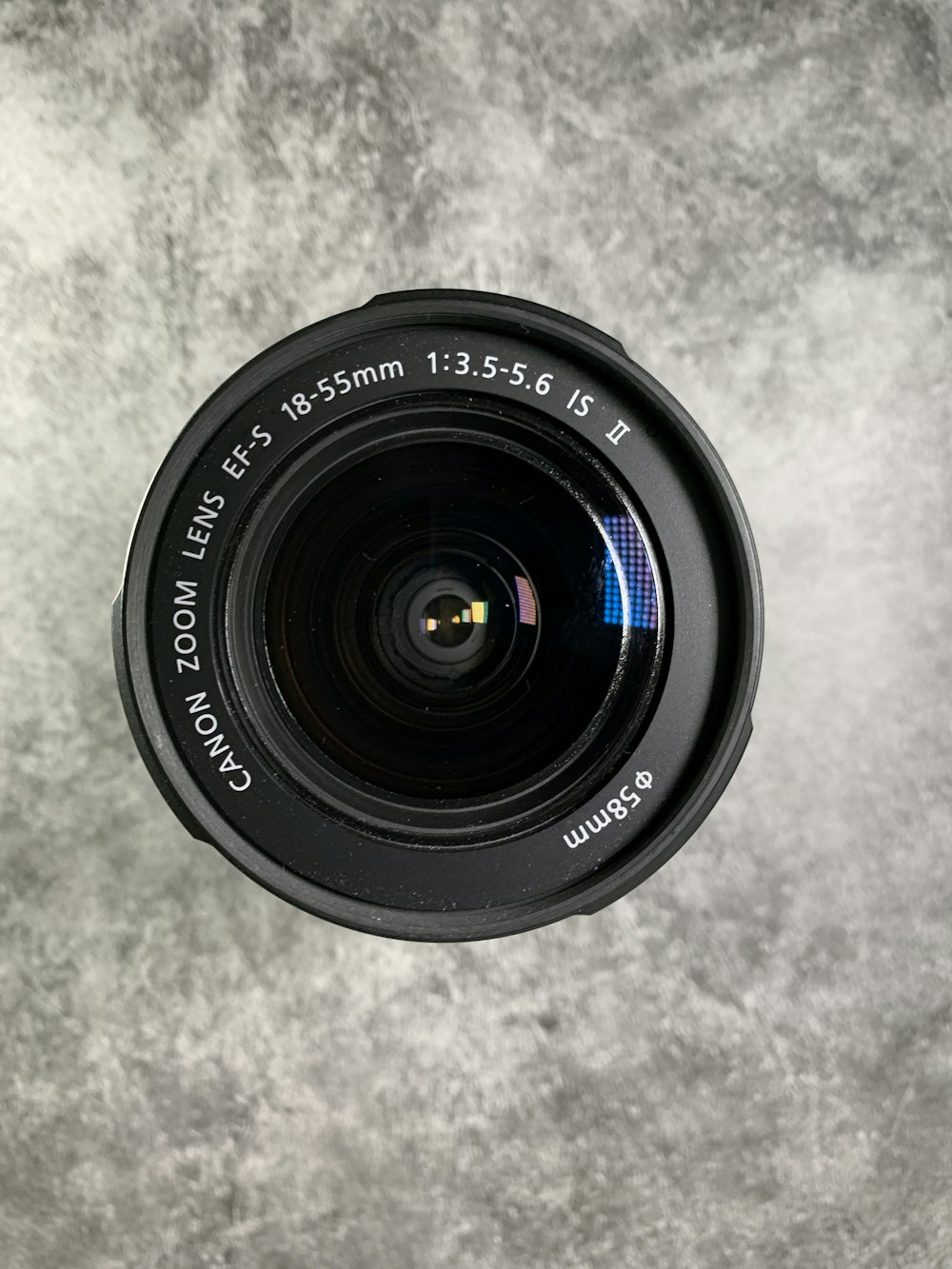 black camera lens on white textile