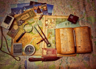 brown wooden scissors on brown and white book