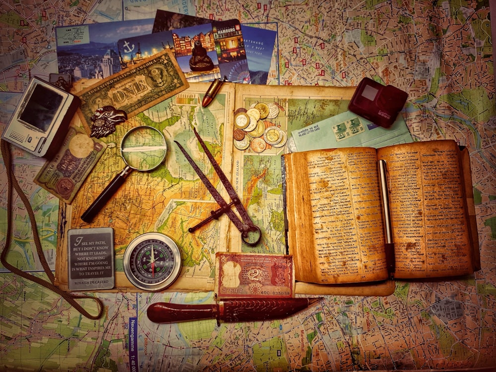 brown wooden scissors on brown and white book