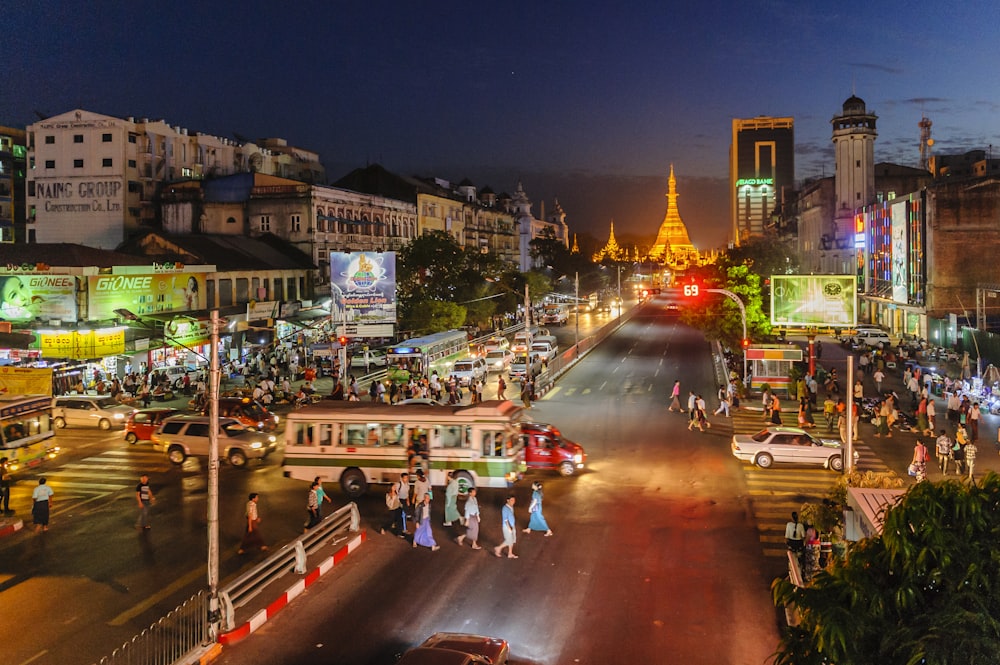 people walking on street during night time